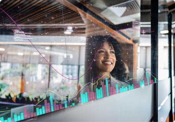 Professional smiling looking at whiteboard.