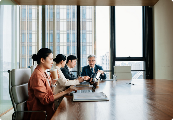 Group of professionals sitting together in a workplace setting.