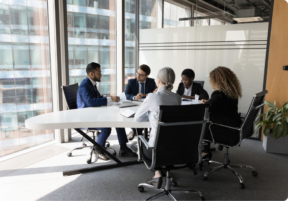 Group of professionals sitting together in a workplace setting.