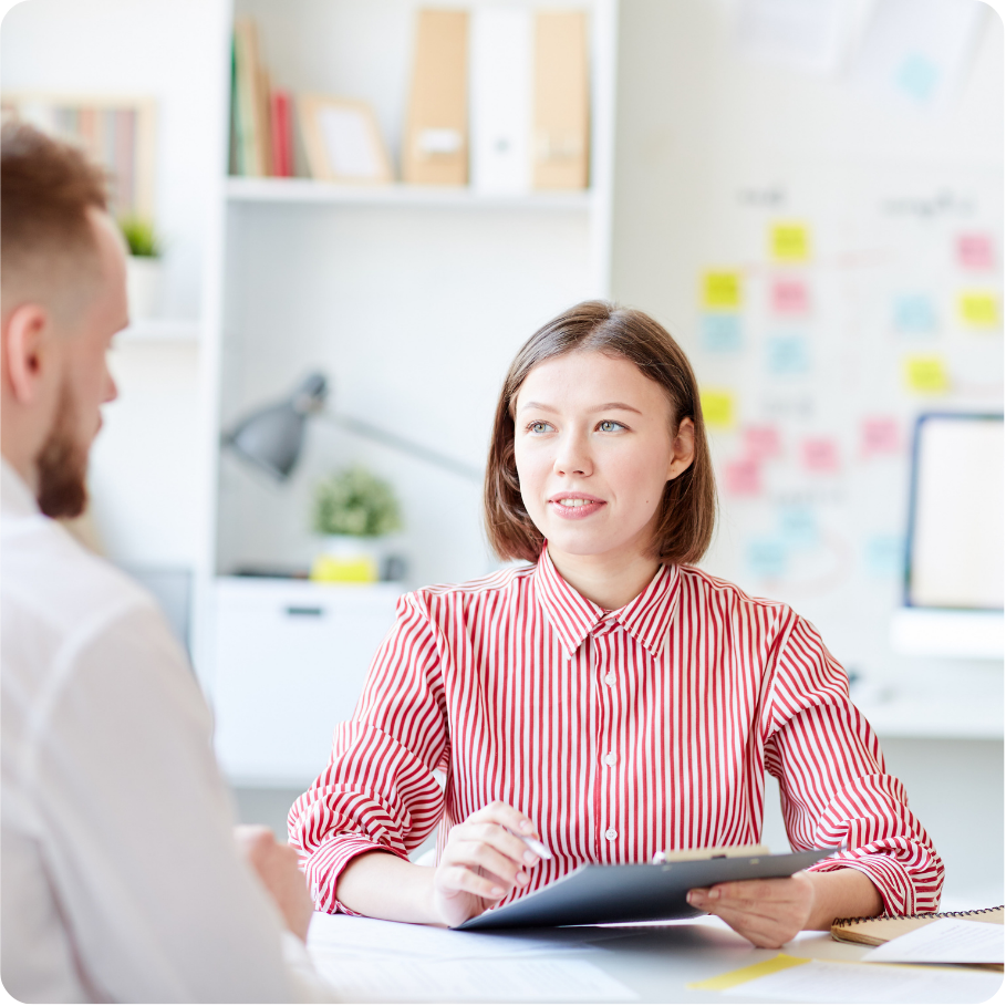 Customer success representative interviewing customer.