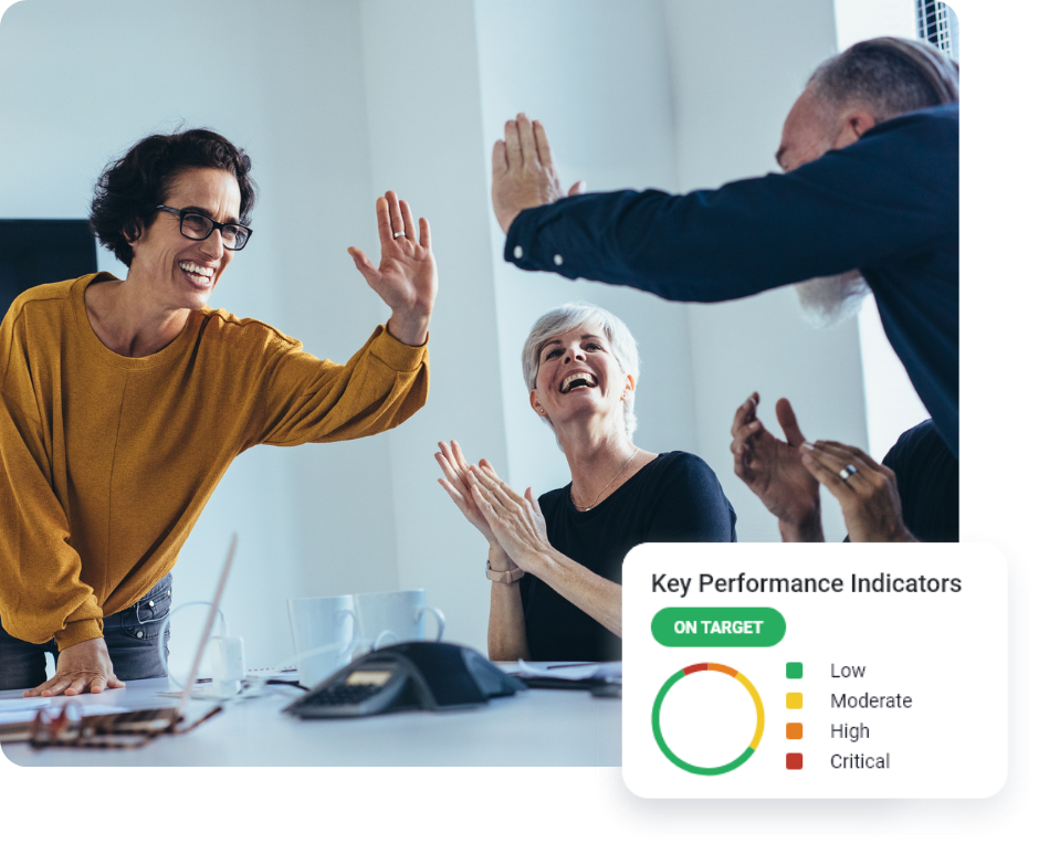 Colleagues celebrating in office setting.