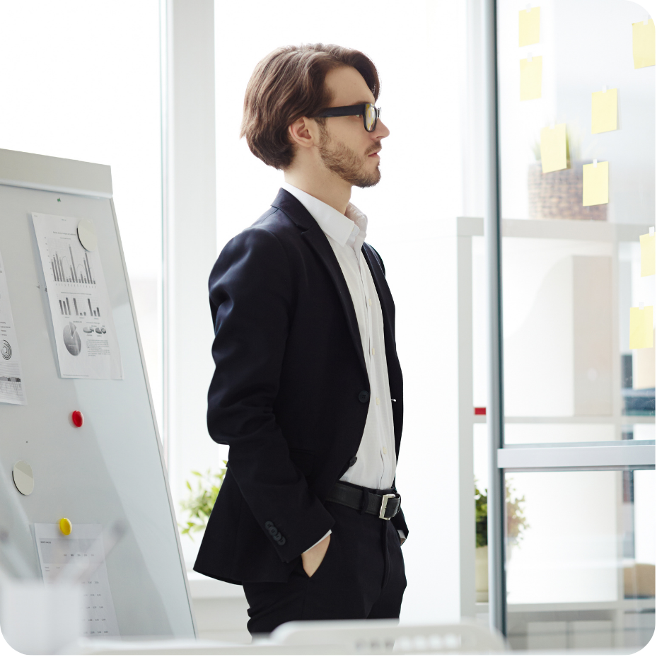 Professional standing in office setting.