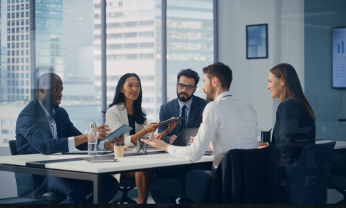 Group of professionals sitting in an office setting.