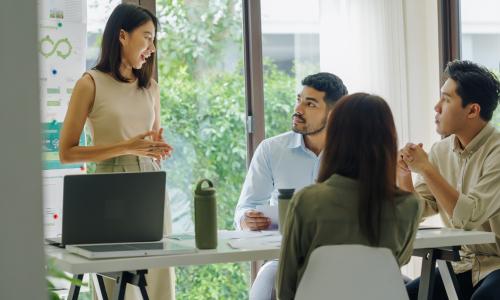Group of professionals sitting in an office setting.
