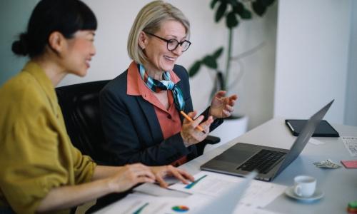 Two professionals in an office setting.