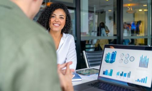 Two professionals in an office setting.