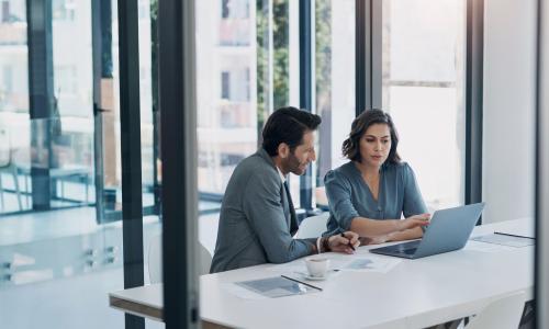 Two professionals in an office setting.