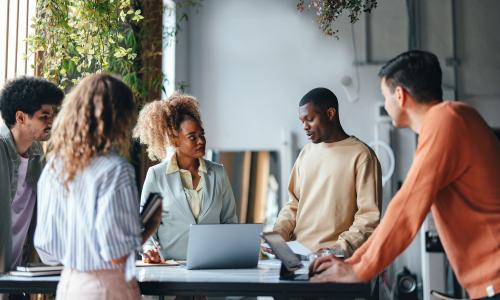 Group of professionals sitting in an office setting.