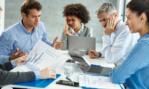 Group of professionals sitting in an office setting.