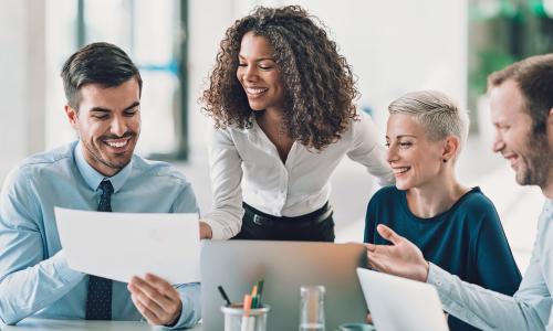 Group of professionals sitting in an office setting.