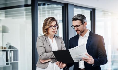 Two professionals in an office setting.