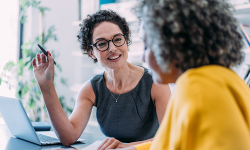 Two professionals in an office setting.