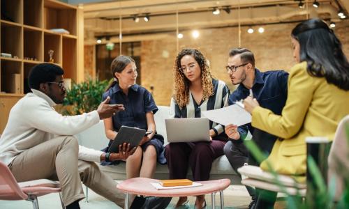 Group of professionals sitting in an office setting.