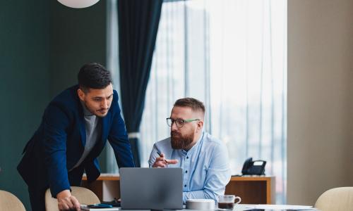 Two professionals in an office setting.