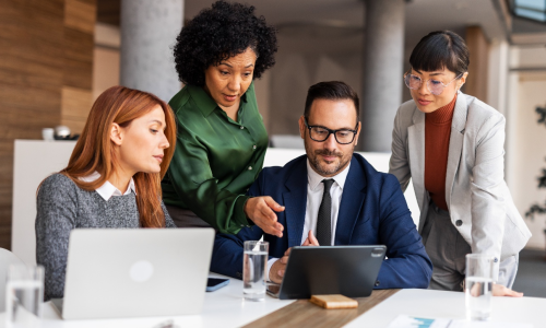 Group of professionals sitting in an office setting.