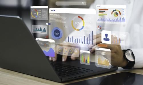 Professional looking at computer monitor in office setting.