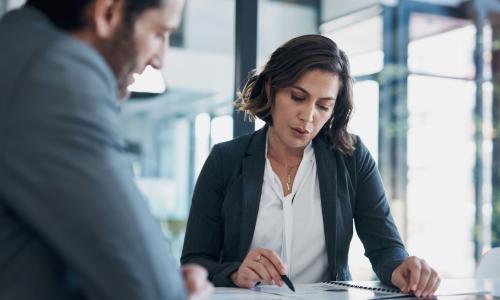 Two professionals in an office setting.
