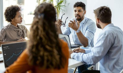 Group of professionals sitting in an office setting.