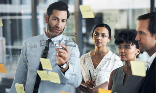 Group of professionals sitting in an office setting.