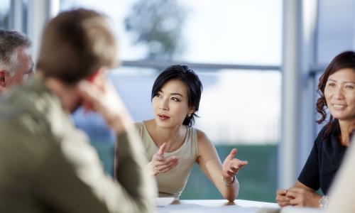 Group of professionals sitting in an office setting.