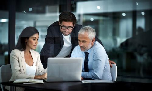 Group of professionals sitting in an office setting.