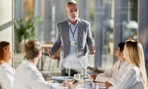 Group of professionals sitting in an office setting.