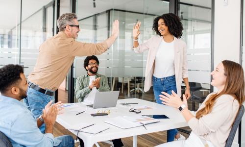Group of professionals sitting in an office setting.