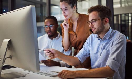 Group of professionals sitting in an office setting.