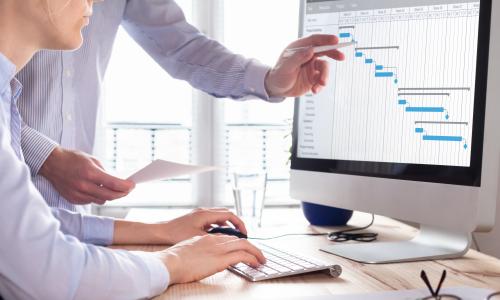 Two professionals in an office setting.