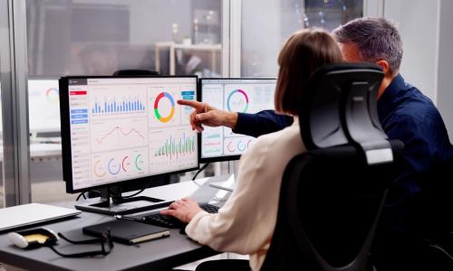 Two professionals in an office setting.