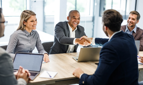 Group of professionals sitting in an office setting.