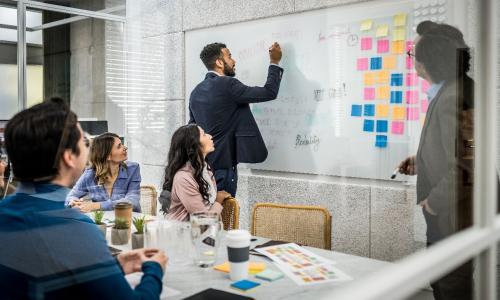 Group of professionals sitting in an office setting.