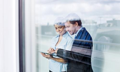 Two professionals in an office setting.