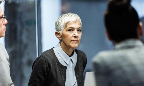 Group of professionals sitting in an office setting.