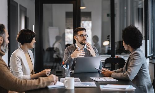 Group of professionals sitting in an office setting.
