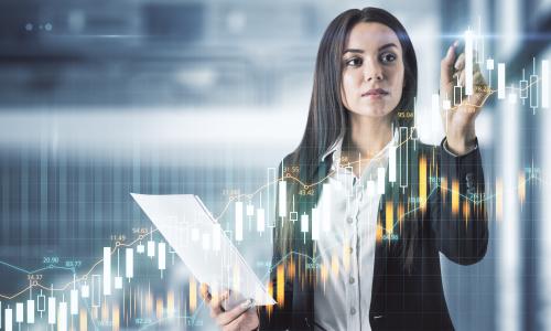 Professional writing on whiteboard in conference room.