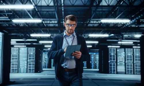 Professional walking in an office setting.