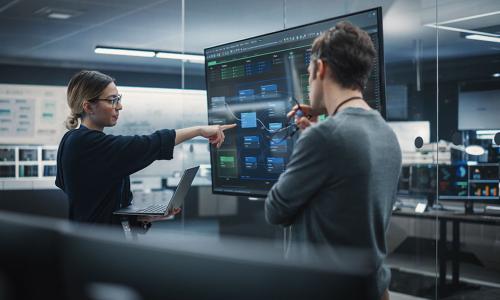 Two professionals in an office setting.