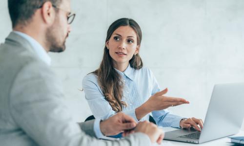 Two professionals in an office setting.
