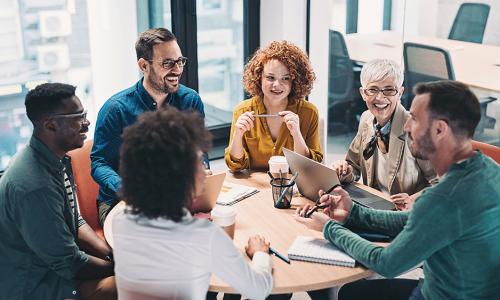 Group of professionals sitting in an office setting.