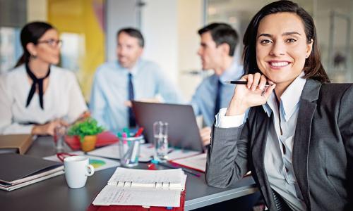 Group of professionals sitting in an office setting.