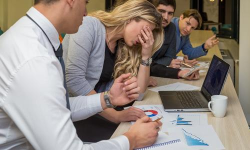 Group of professionals sitting in an office setting.