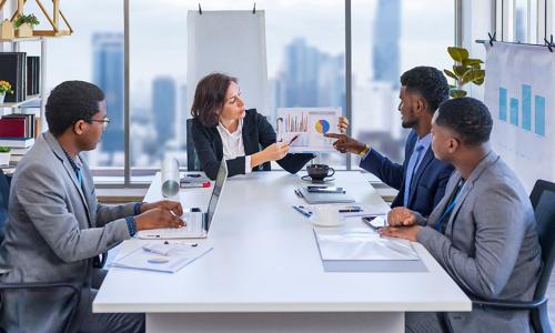 Group of professionals sitting in an office setting.